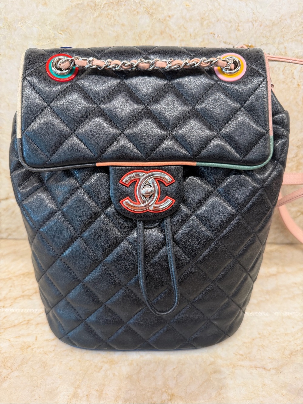CHANEL Black Quilted Leather Backpack with Multicolor Trim and Red CC